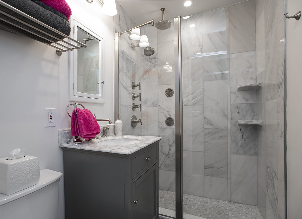 Bright, clean bathroom with mirror and sink